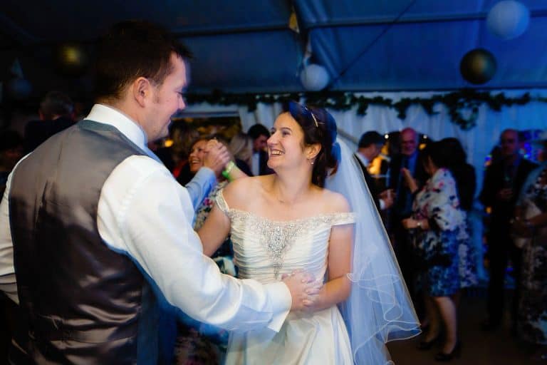 bride and groom dancing at their betton farm wedding - fun and creative wedding photography by emma and rich