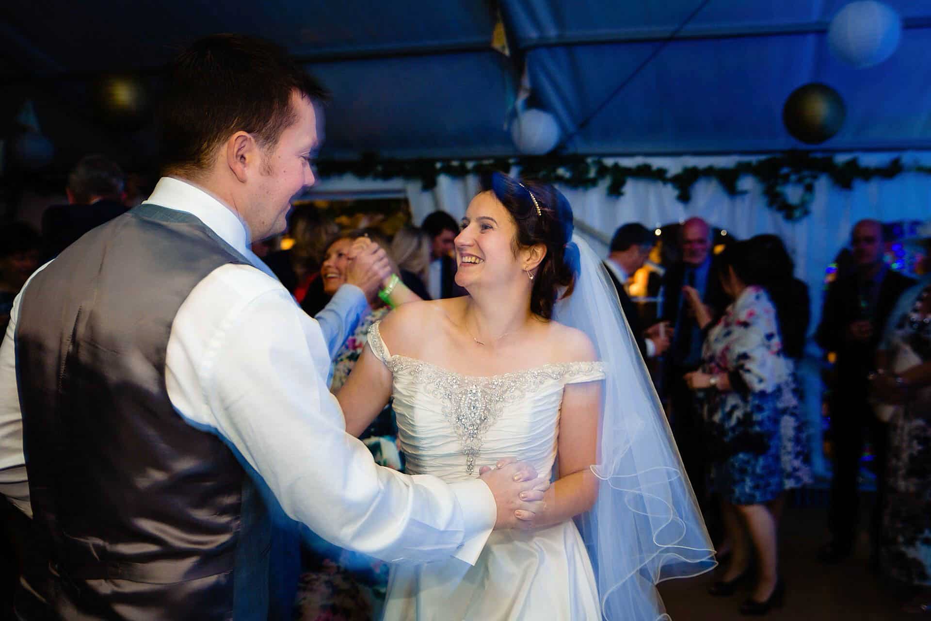 bride and groom dancing at their betton farm wedding - fun and creative wedding photography by emma and rich