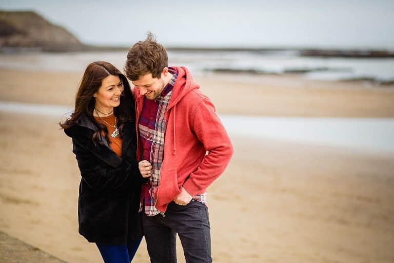 a newly engaged couple on scarborough beach, scarborough engagement photography by emma and rich