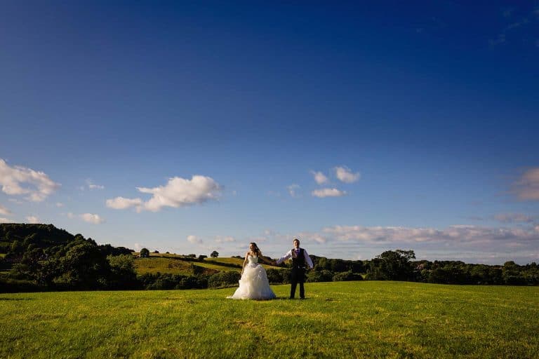newly wed couple pose at ox pasture hall wedding photography by emma and rich