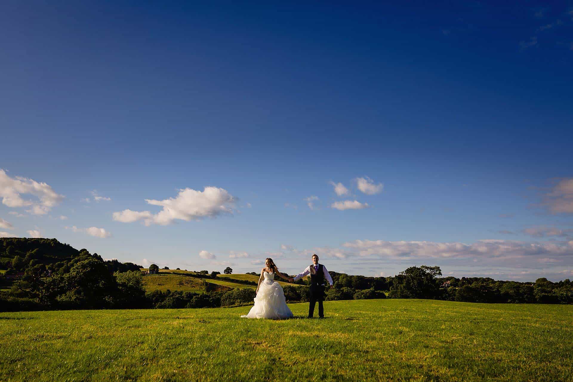 newly wed couple pose at ox pasture hall wedding photography by emma and rich