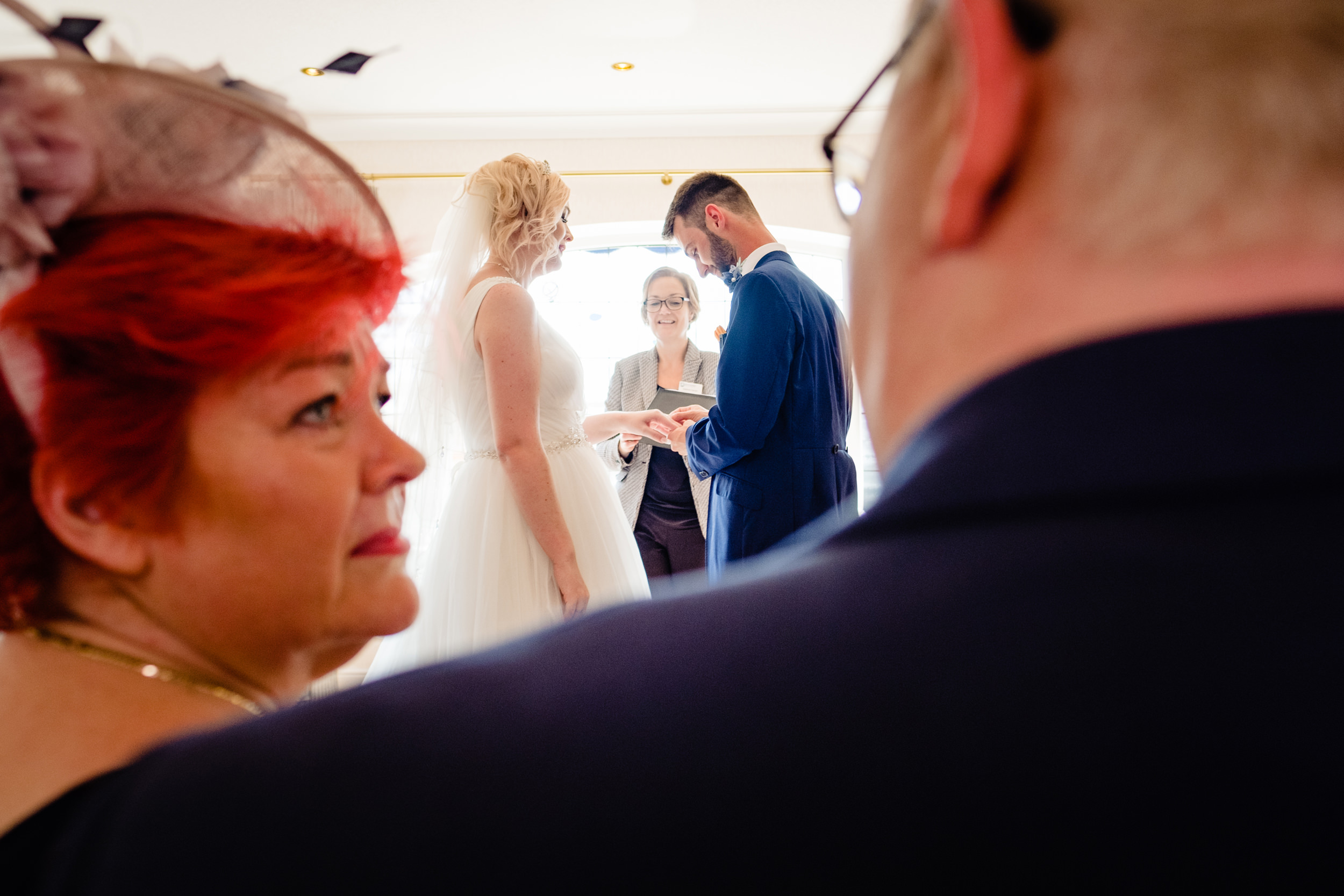 parents watch as daughter gets married. grand hotel scarborough wedding photography by emma and rich.