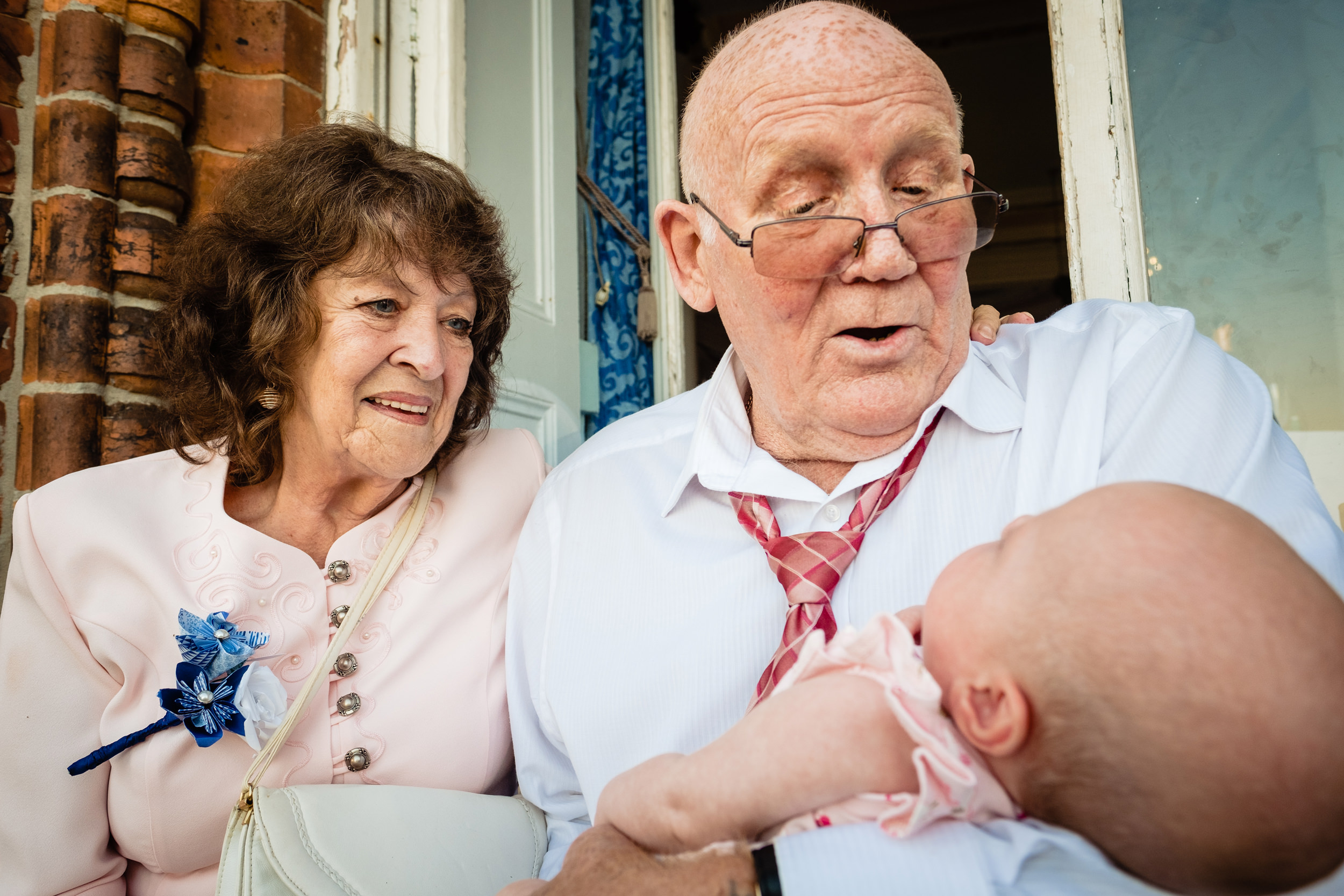 grandparents holding baby. grand hotel scarborough wedding photography by emma and rich.