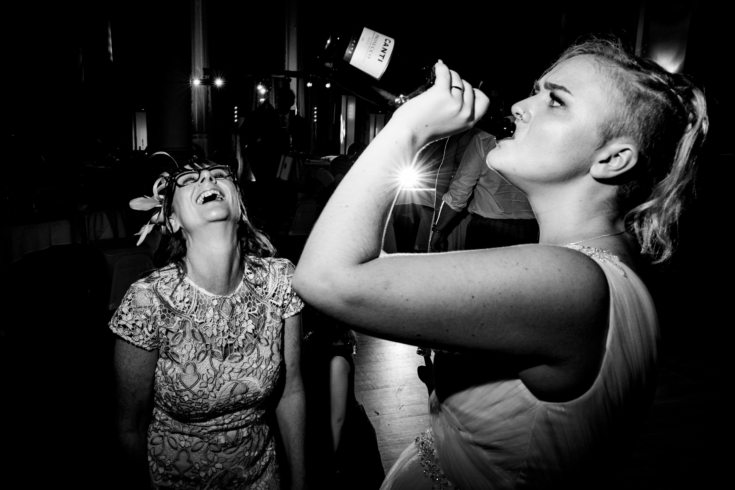 bride drinking wine from bottle. grand hotel scarborough wedding photography by emma and rich.