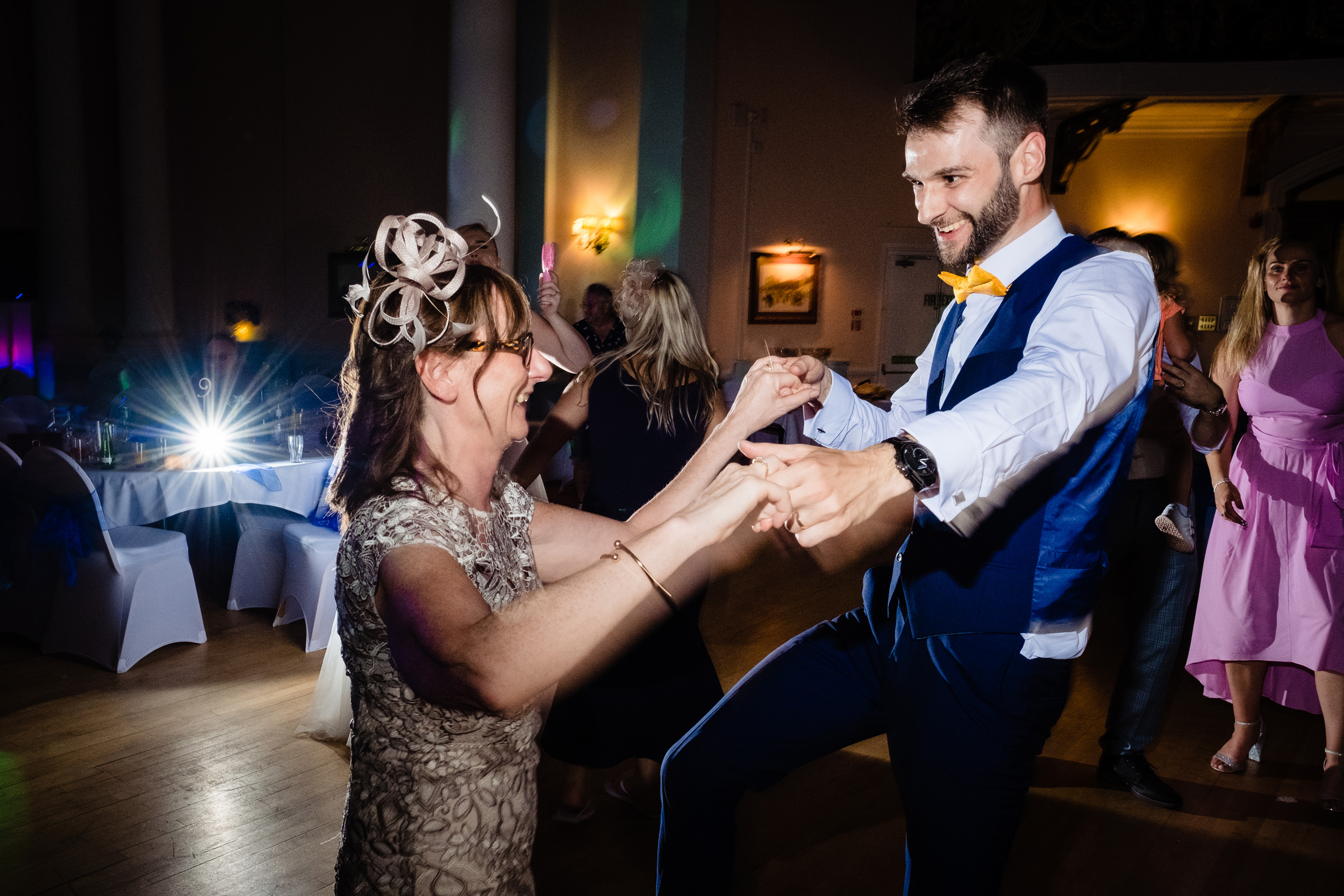groom dancing with mum. grand hotel scarborough wedding photography by emma and rich.