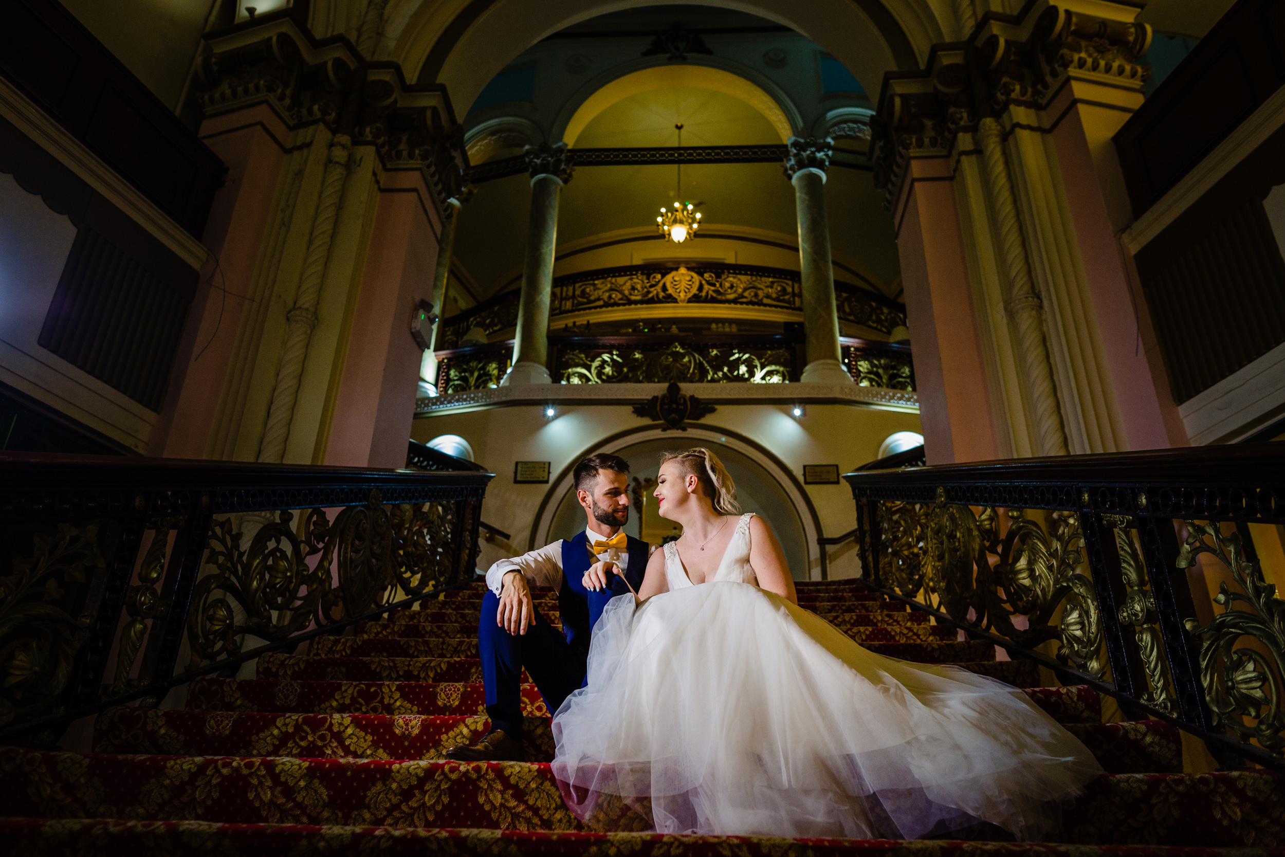 bride and groom sat on the staircase - grand hotel scarborough wedding photography