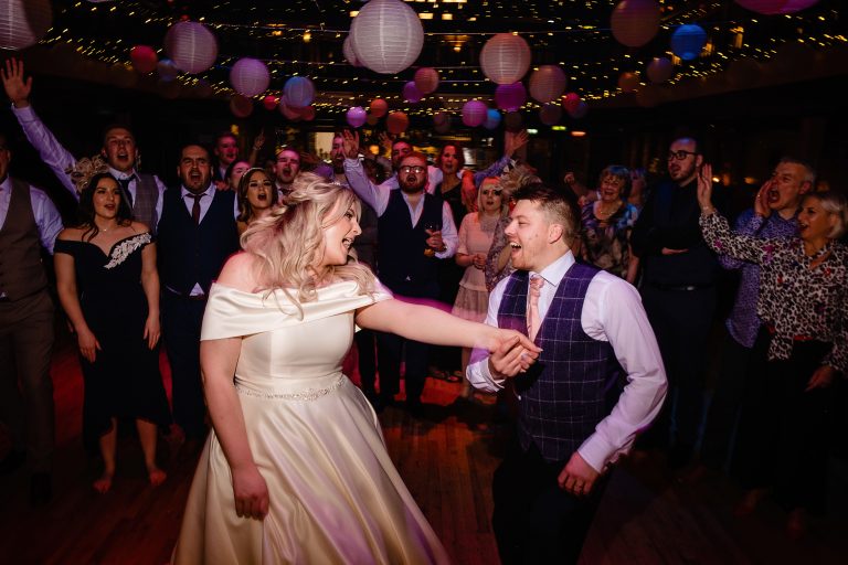 a newly married couple dance at the engine shed in wetherby. photo by emma and rich.