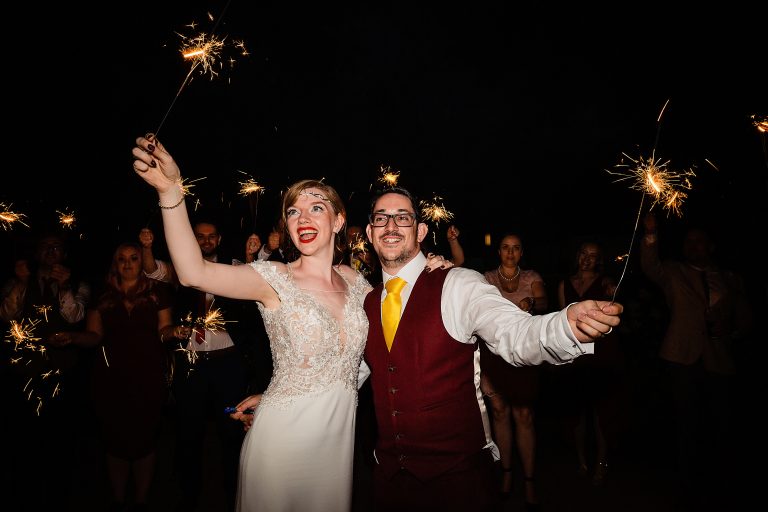 a bride and groom playing with sparklers. sandhole oak barn wedding photography by emma and rich