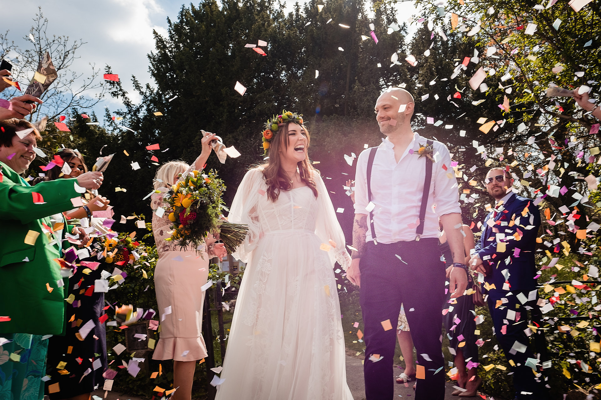 bride and groom covered in confetti at a hull wedding venue