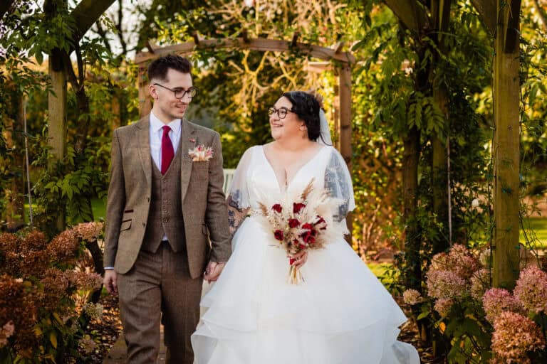 A bride and groom in the garden. sandburn Hall wedding photography by emma and rich.